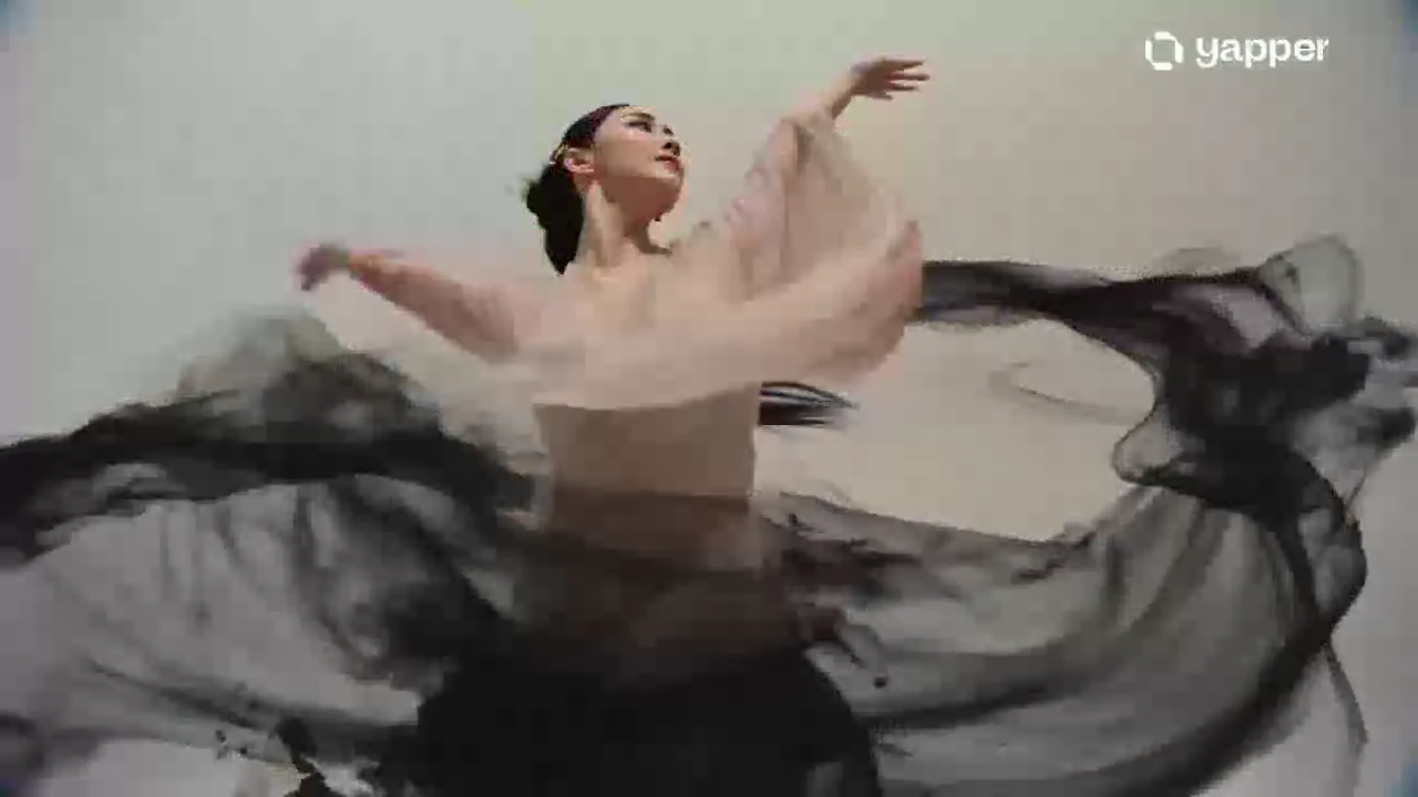 A dancer moves through flowing black ink and watercolor.